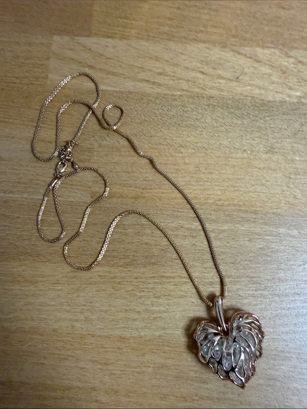 Rose gold long pendant barrel necklace with rhinestone filled heart charm